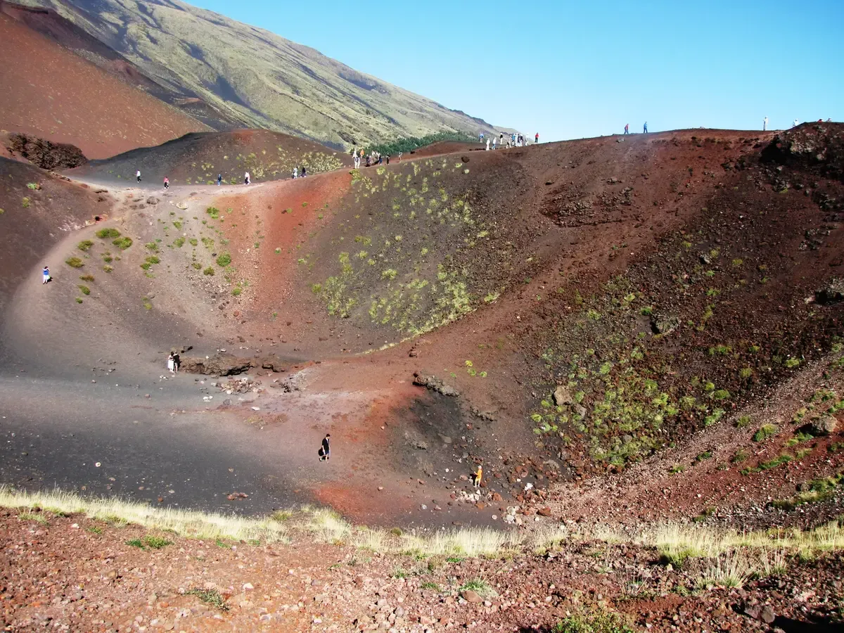 Visitors walking the crater rims of the Silvestri craters on a Mount Etna half-day tour, Sicily